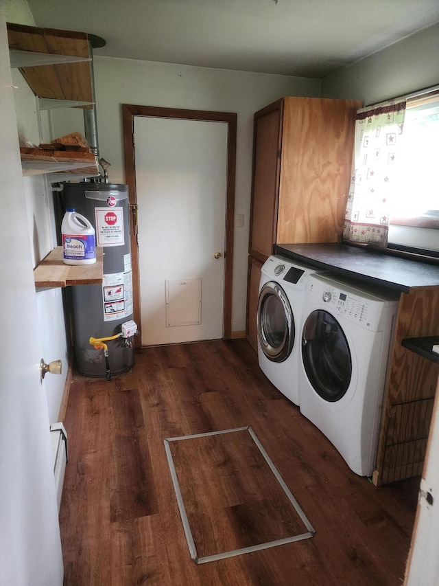 washroom with washer and dryer, dark wood-type flooring, cabinets, and water heater