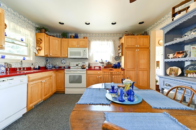 kitchen featuring white appliances and sink