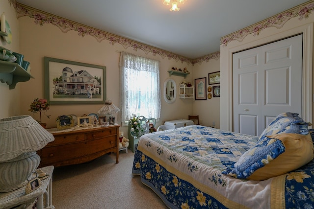 bedroom with carpet flooring and a closet