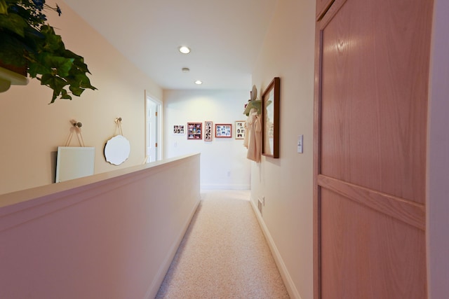 corridor with light colored carpet