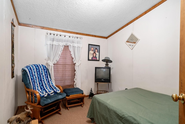 carpeted bedroom with ornamental molding and a textured ceiling