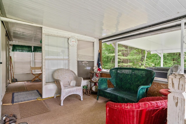 sunroom / solarium featuring vaulted ceiling