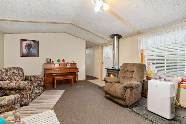 carpeted living room with lofted ceiling, a textured ceiling, and a wood stove