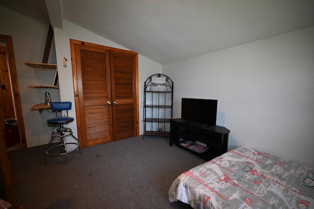 carpeted bedroom with a textured ceiling, a closet, and lofted ceiling