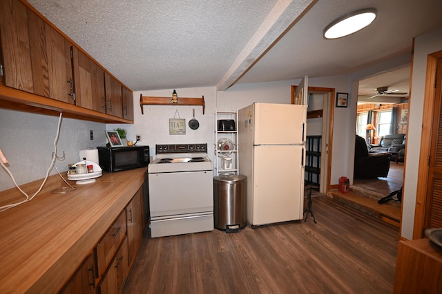 kitchen with lofted ceiling, white appliances, a textured ceiling, ceiling fan, and dark hardwood / wood-style floors