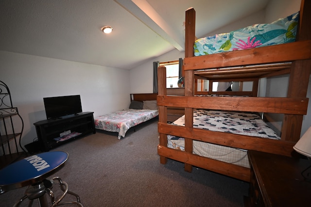 bedroom featuring carpet and lofted ceiling