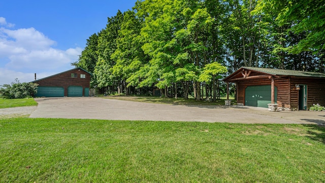 exterior space featuring an outbuilding and a garage