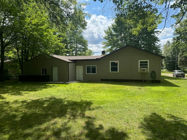 rear view of house with a lawn