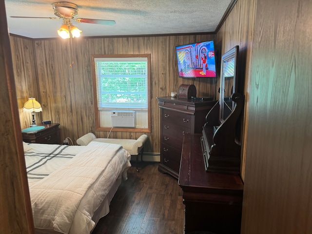 bedroom with dark wood-type flooring, cooling unit, ornamental molding, a textured ceiling, and ceiling fan