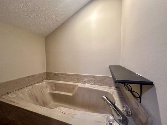 bathroom with a textured ceiling