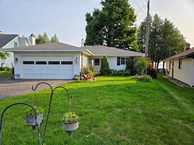 ranch-style house with a garage and a front yard