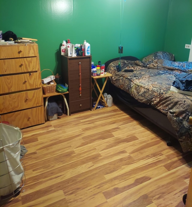 bedroom with light wood-type flooring