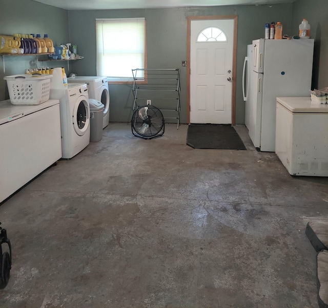 washroom with washing machine and clothes dryer