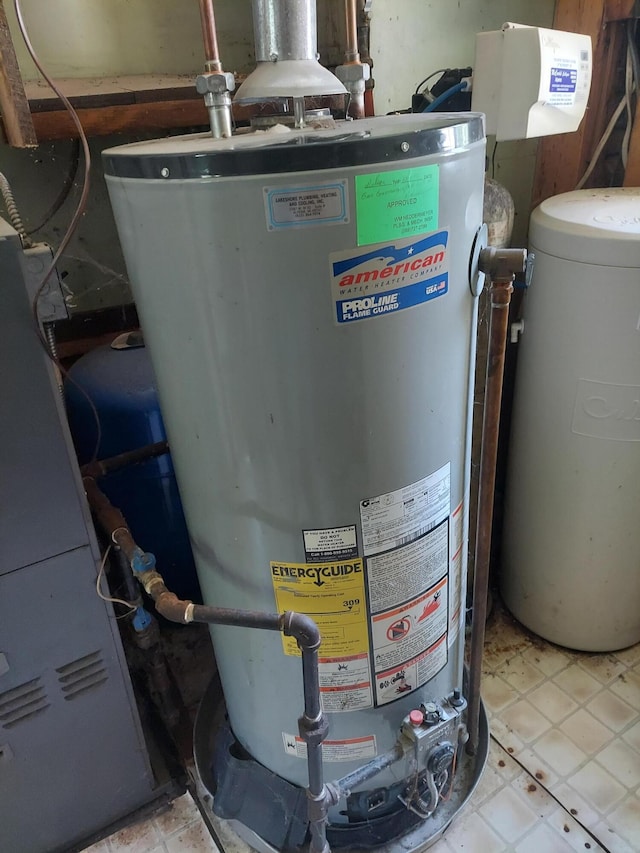 utility room featuring water heater