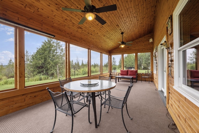 sunroom / solarium featuring wooden ceiling, ceiling fan, and vaulted ceiling