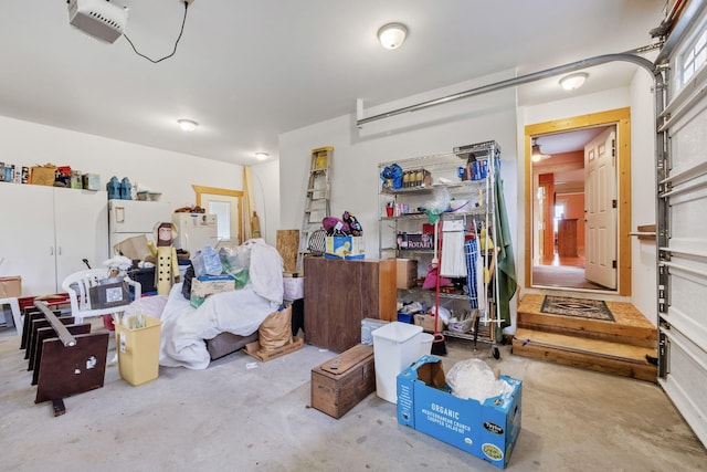 garage with a garage door opener and white refrigerator