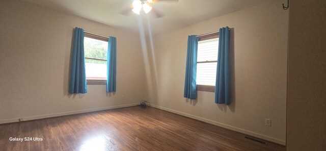 empty room featuring ceiling fan and wood-type flooring