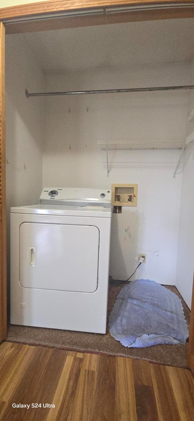 laundry area featuring washer / clothes dryer and hardwood / wood-style floors