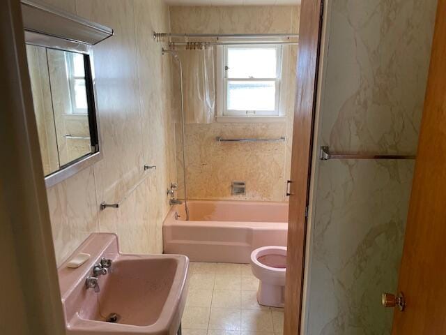 full bathroom with sink, toilet, tile patterned floors, and shower / bath combo