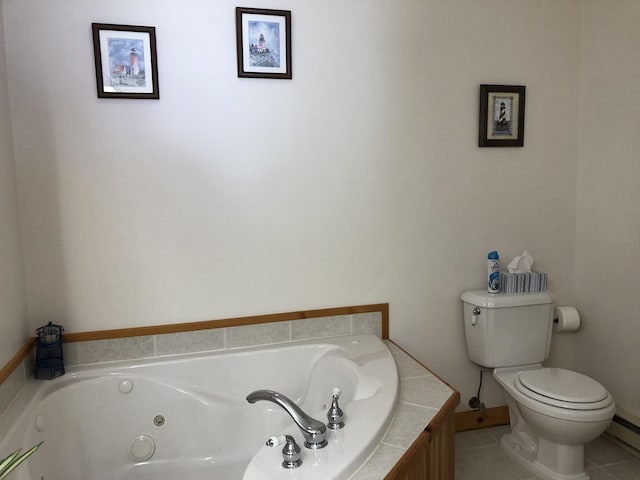 bathroom featuring a relaxing tiled tub, tile patterned floors, and toilet