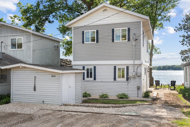 rear view of house with a water view