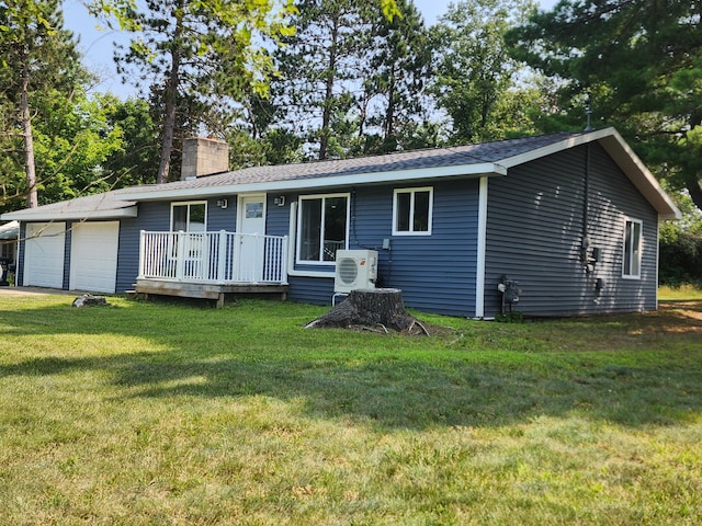 exterior space with a garage and a front lawn