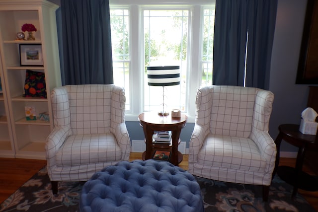 sitting room with hardwood / wood-style flooring