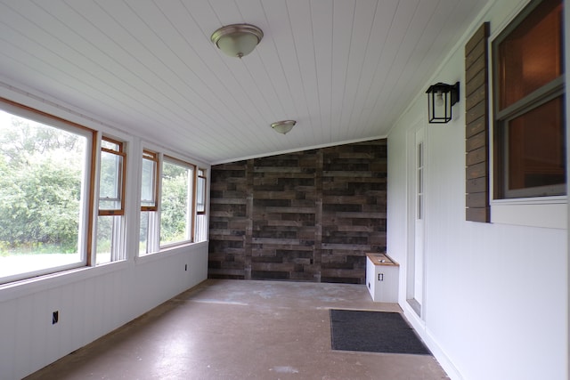 unfurnished sunroom with wood ceiling and lofted ceiling