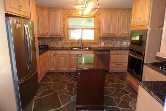 kitchen with sink, light brown cabinets, stainless steel appliances, tasteful backsplash, and dark stone counters