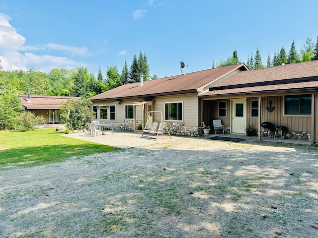 rear view of house with a patio