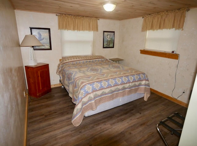 bedroom featuring dark hardwood / wood-style flooring and wooden ceiling