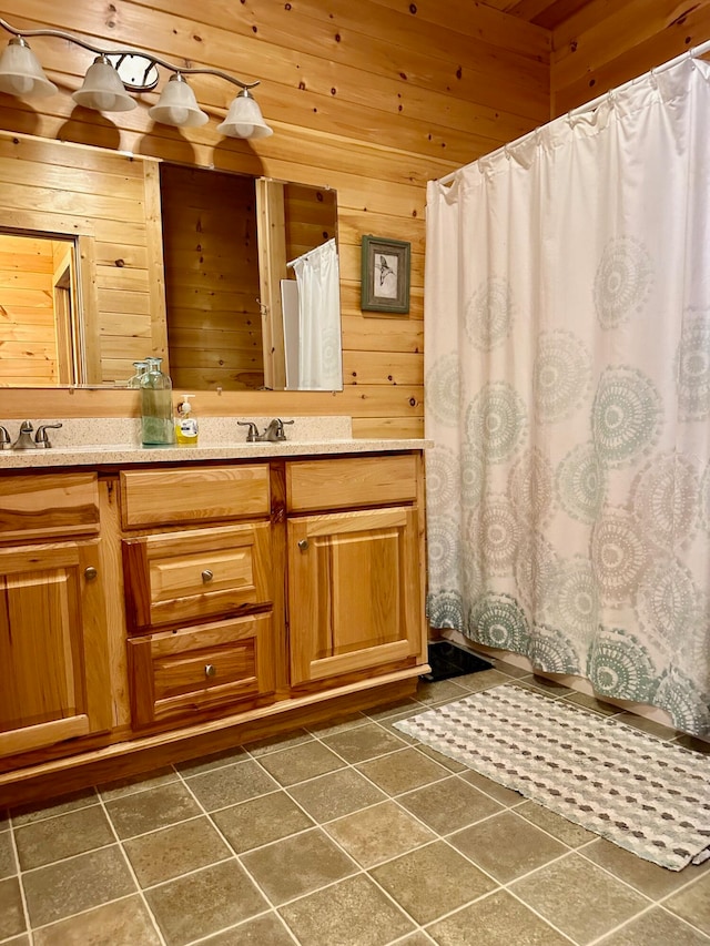 bathroom featuring vanity, tile patterned flooring, wooden walls, and wooden ceiling