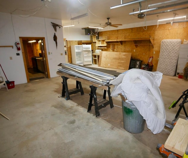 garage featuring a garage door opener and ceiling fan