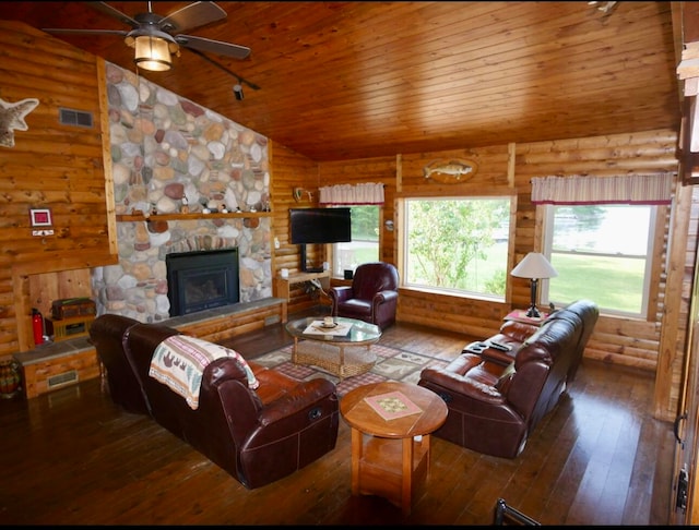 living room featuring lofted ceiling, ceiling fan, hardwood / wood-style floors, wooden ceiling, and a stone fireplace