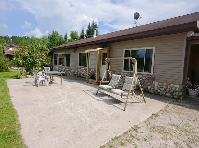 back of property featuring a patio area