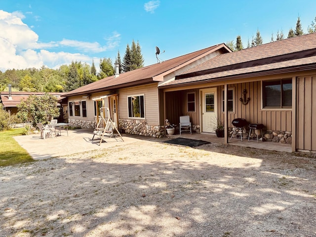 back of property featuring a patio