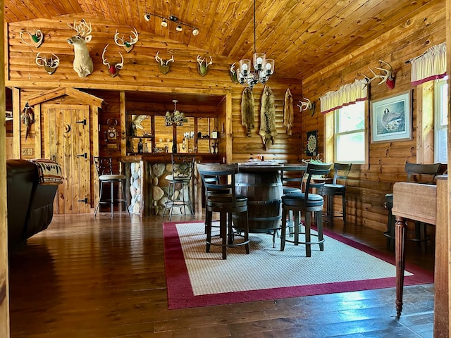 dining space with vaulted ceiling, wood ceiling, an inviting chandelier, rustic walls, and wood-type flooring