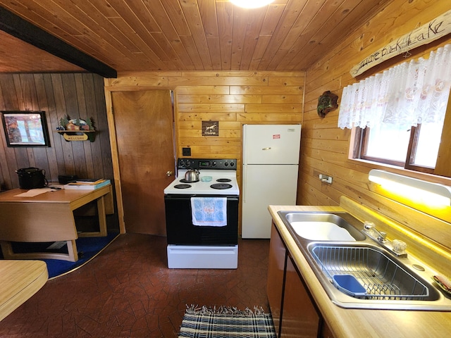 kitchen with sink, wooden walls, and white appliances