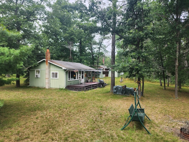 view of yard with a wooden deck