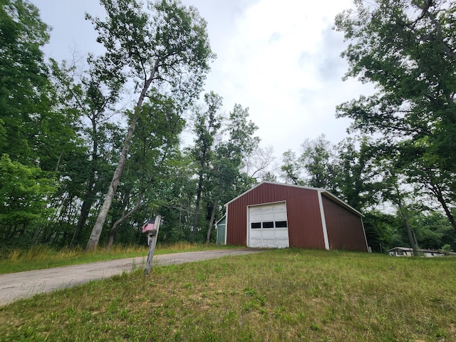 exterior space with a garage and a yard