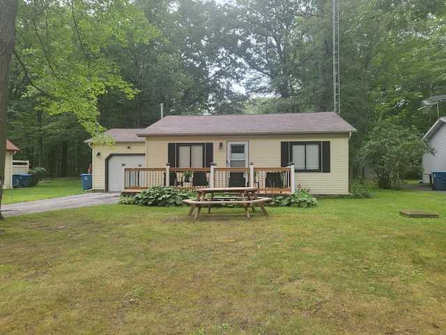 view of front facade with a garage and a front lawn