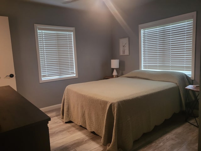 bedroom with light hardwood / wood-style flooring