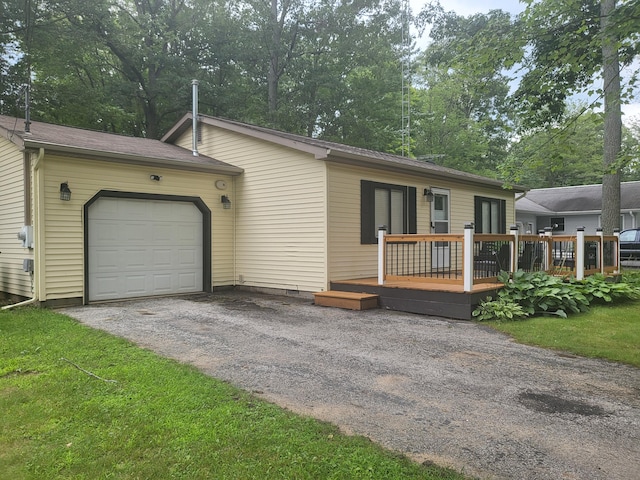 single story home featuring a wooden deck and a front yard