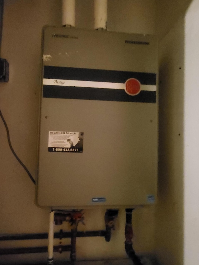 utility room with tankless water heater