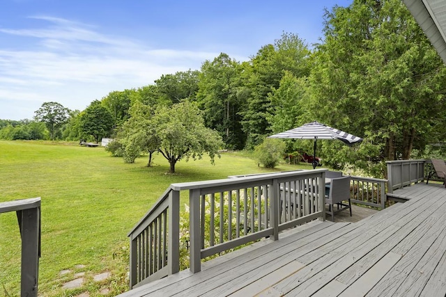 deck featuring a lawn