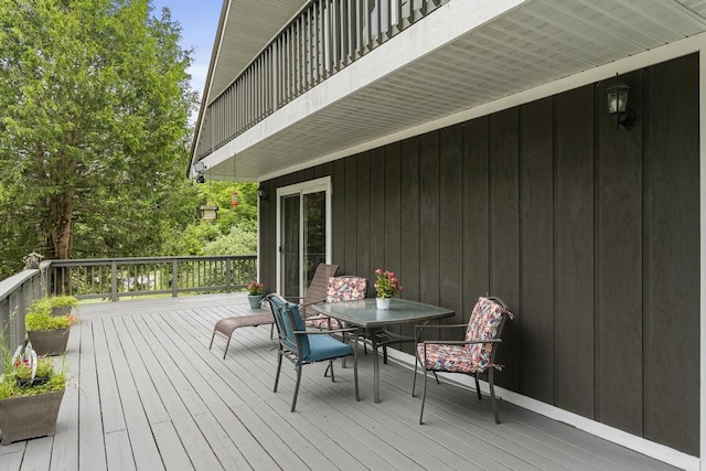 wooden deck featuring outdoor dining space