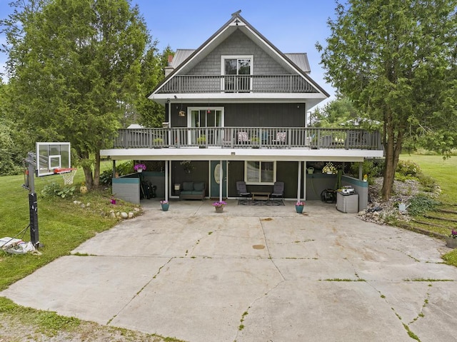 rear view of house with a lawn