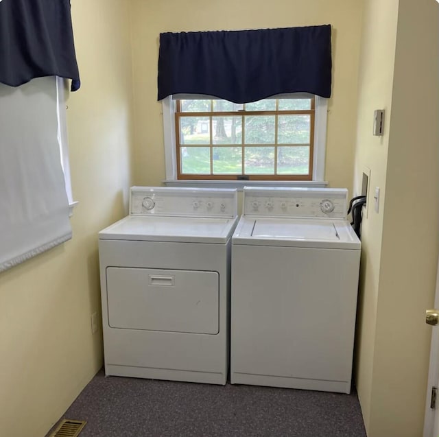 laundry room featuring washer and clothes dryer