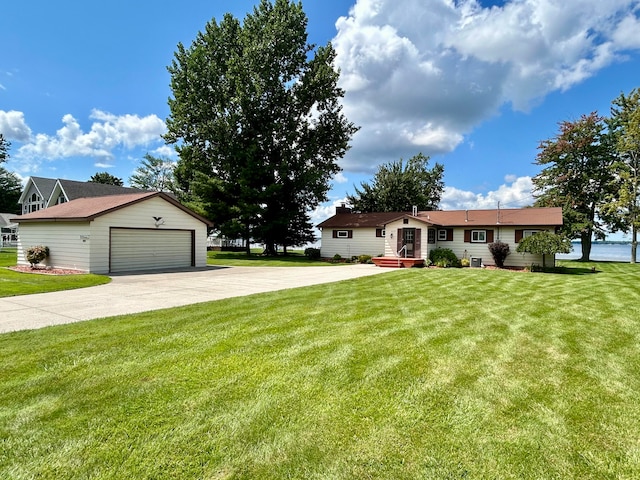 ranch-style house with a garage, an outdoor structure, and a front yard