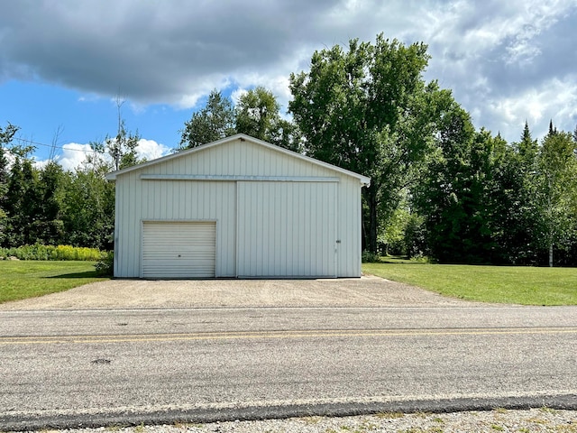 garage with a yard